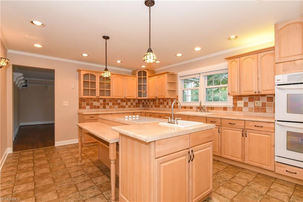 7836 Alcorn Road Oak Ridge, NC 27310 - Photo 3 of 28 Updated kitchen in 2008 - recessed and pendant lighting, prep sink, smooth cook top, and double ovens