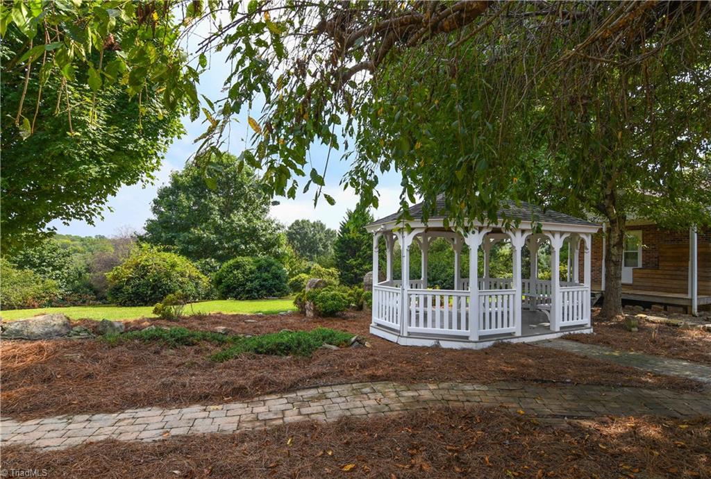 7836 Alcorn Road Oak Ridge, NC 27310 - Photo 21 of 28 A restful and peaceful spot with a water feature near by.