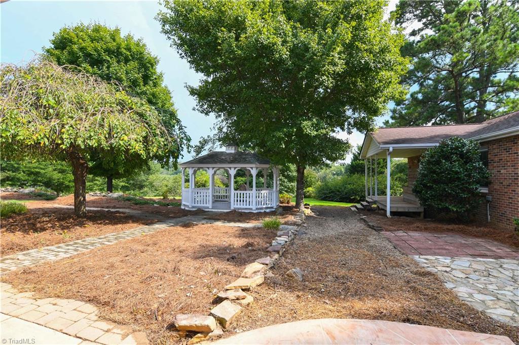 7836 Alcorn Road Oak Ridge, NC 27310 - Photo 22 of 28 With fall days approaching, there is no better place to relax on those cool evenings and observe the brilliant colors of fall. Take note of the patio area and the covered porch that is located off of the 2nd bedroom.