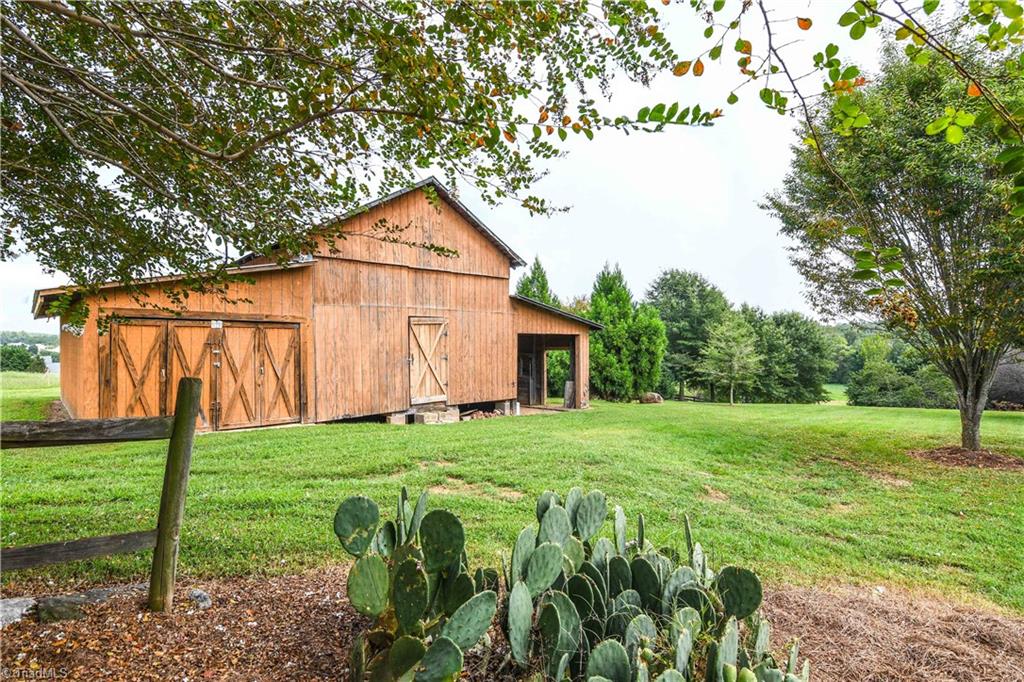 7836 Alcorn Road Oak Ridge, NC 27310 - Photo 27 of 28 The Barn - perfect for storing garden and lawn equipment.