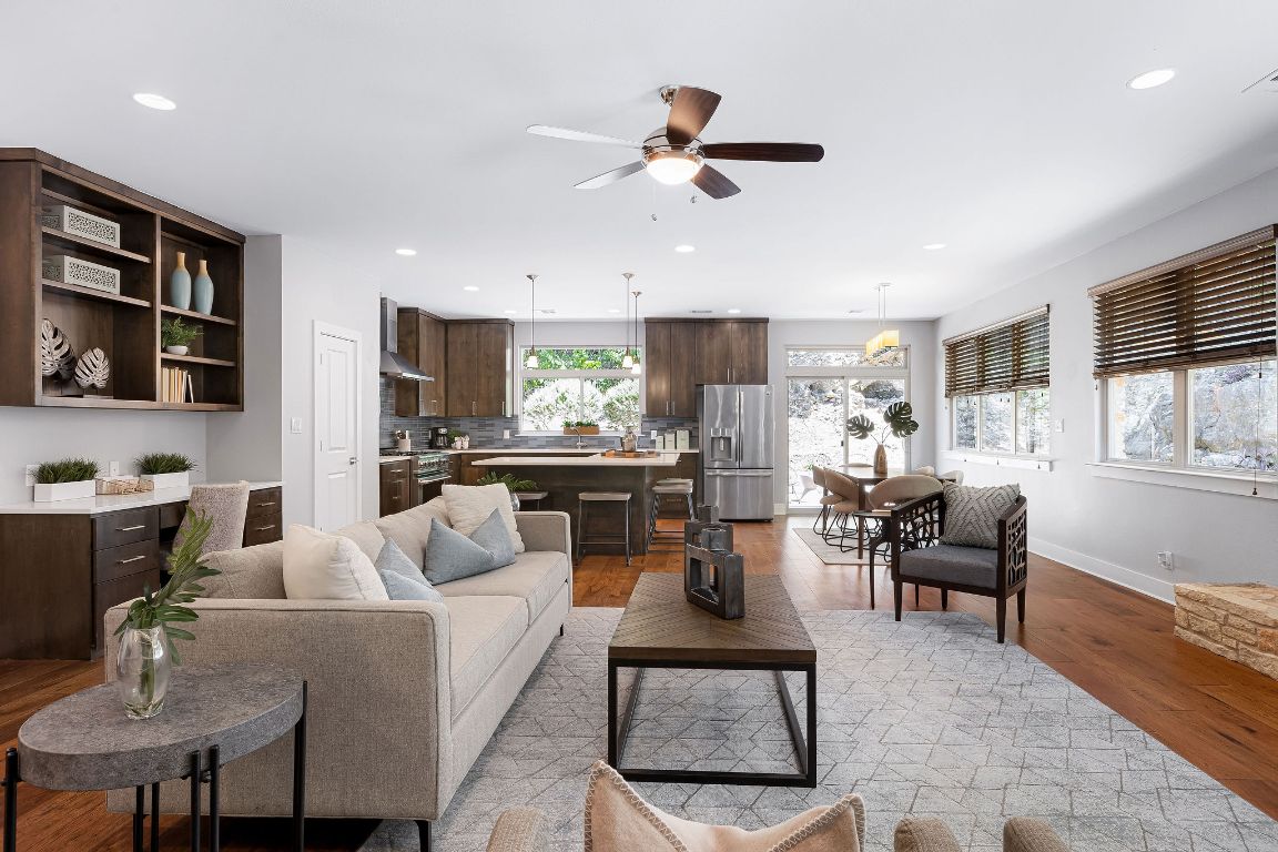 a living room with furniture and kitchen view