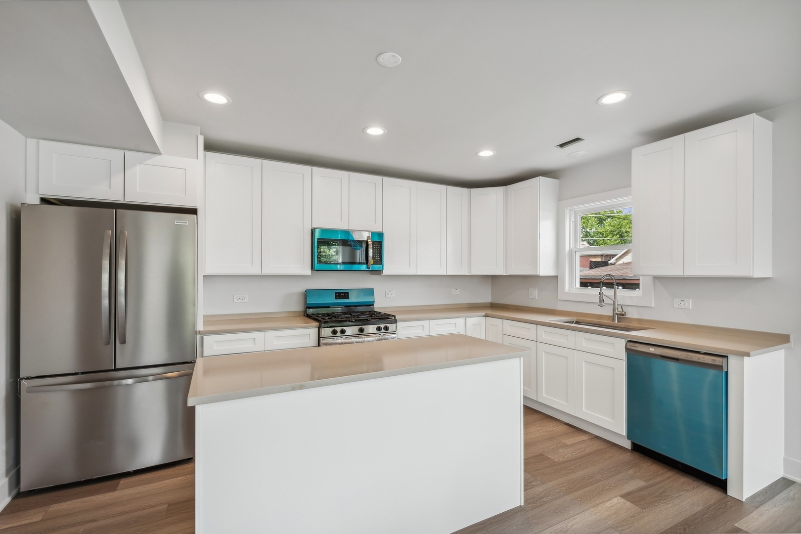 3529 South 54th Avenue Cicero, IL 60804 - Photo 5 of 19 a kitchen with stainless steel appliances a refrigerator sink and white cabinets