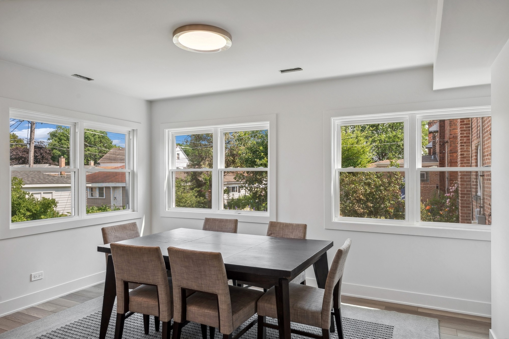 3529 South 54th Avenue Cicero, IL 60804 - Photo 6 of 19 a view of a dining room with furniture a chandelier and wooden floor