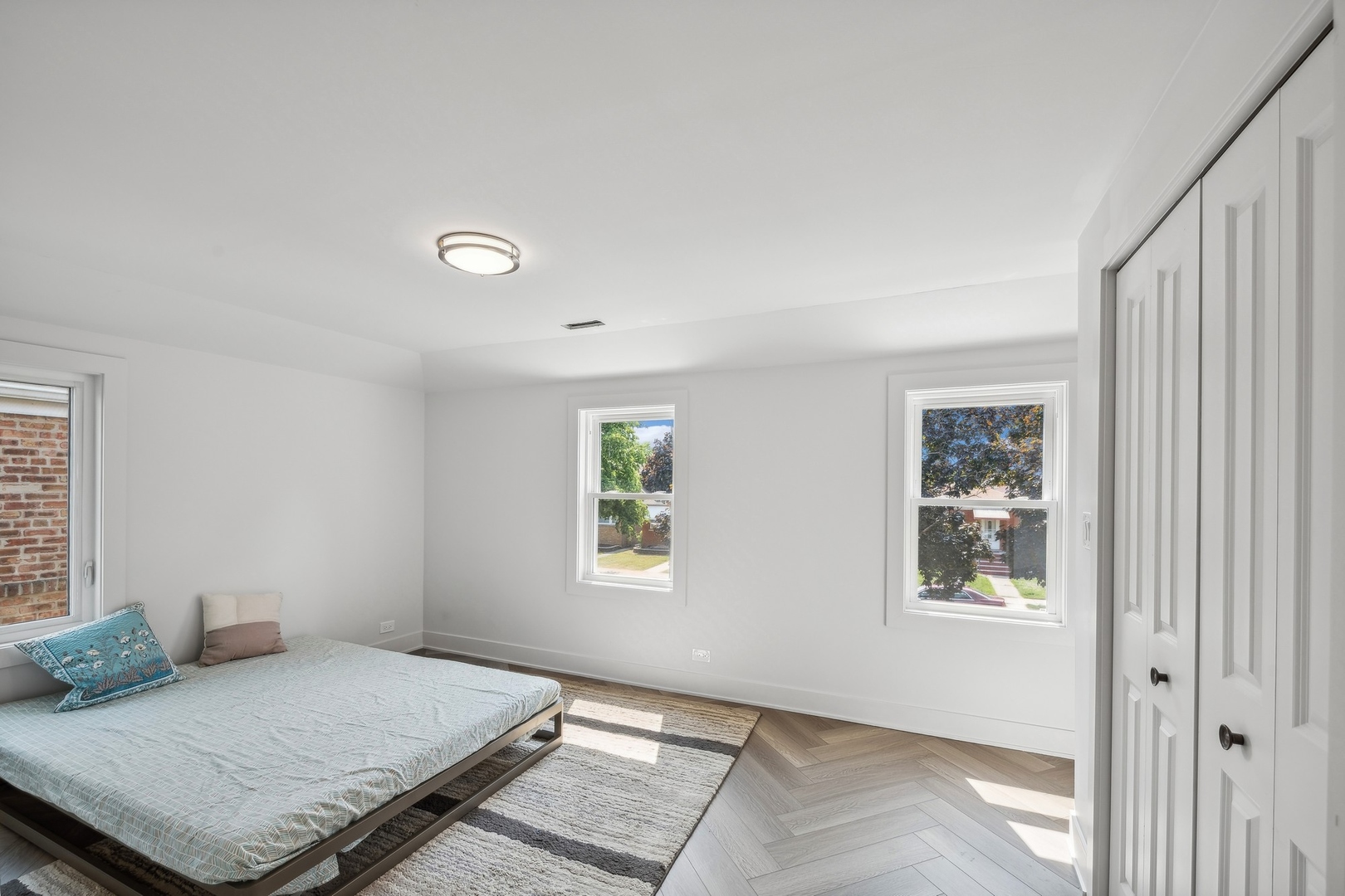 3529 South 54th Avenue Cicero, IL 60804 - Photo 10 of 19 a bedroom with a bed and a window