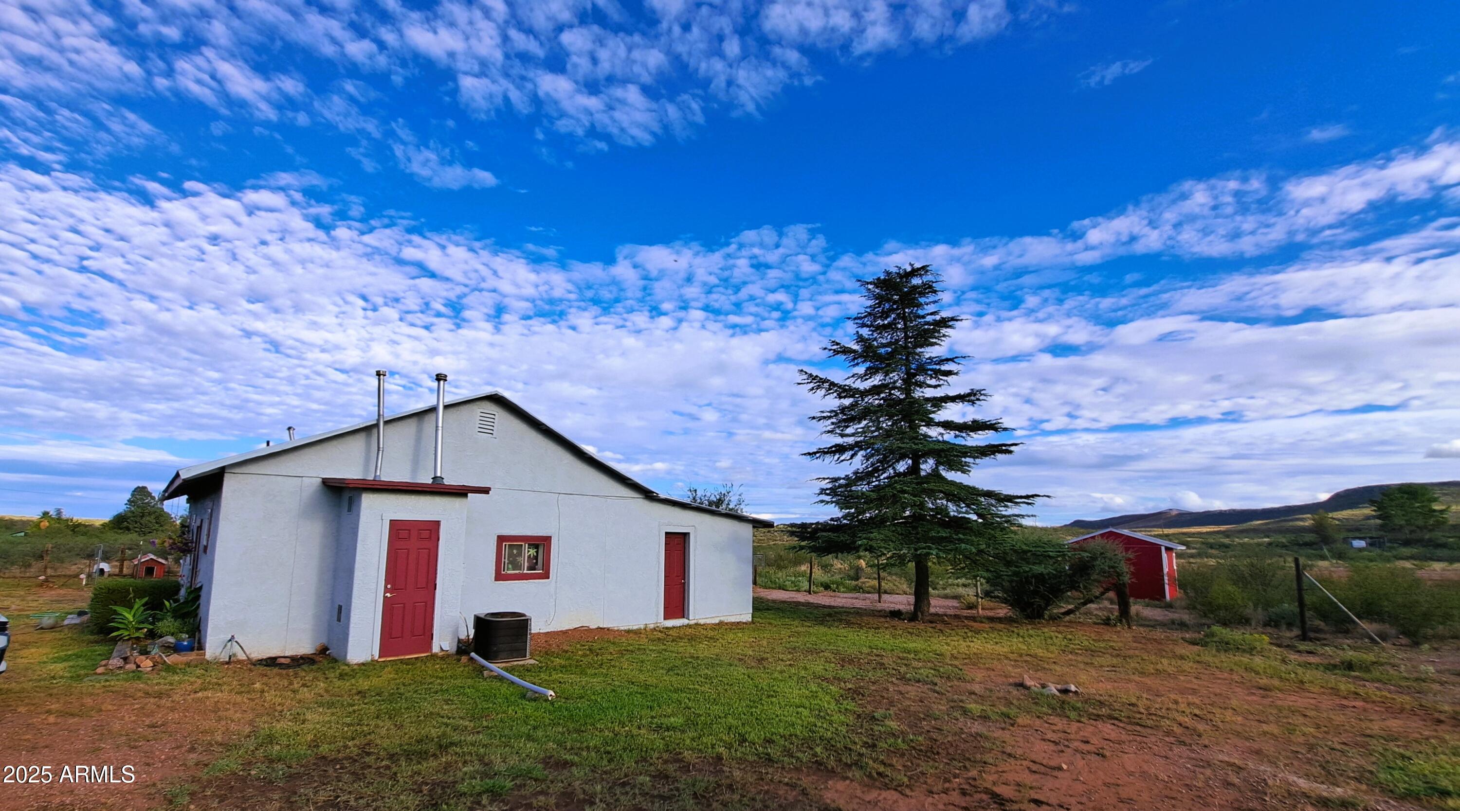 653 East Border Road Bisbee, AZ 85603 - Photo 20 of 29 a view of a house with a yard