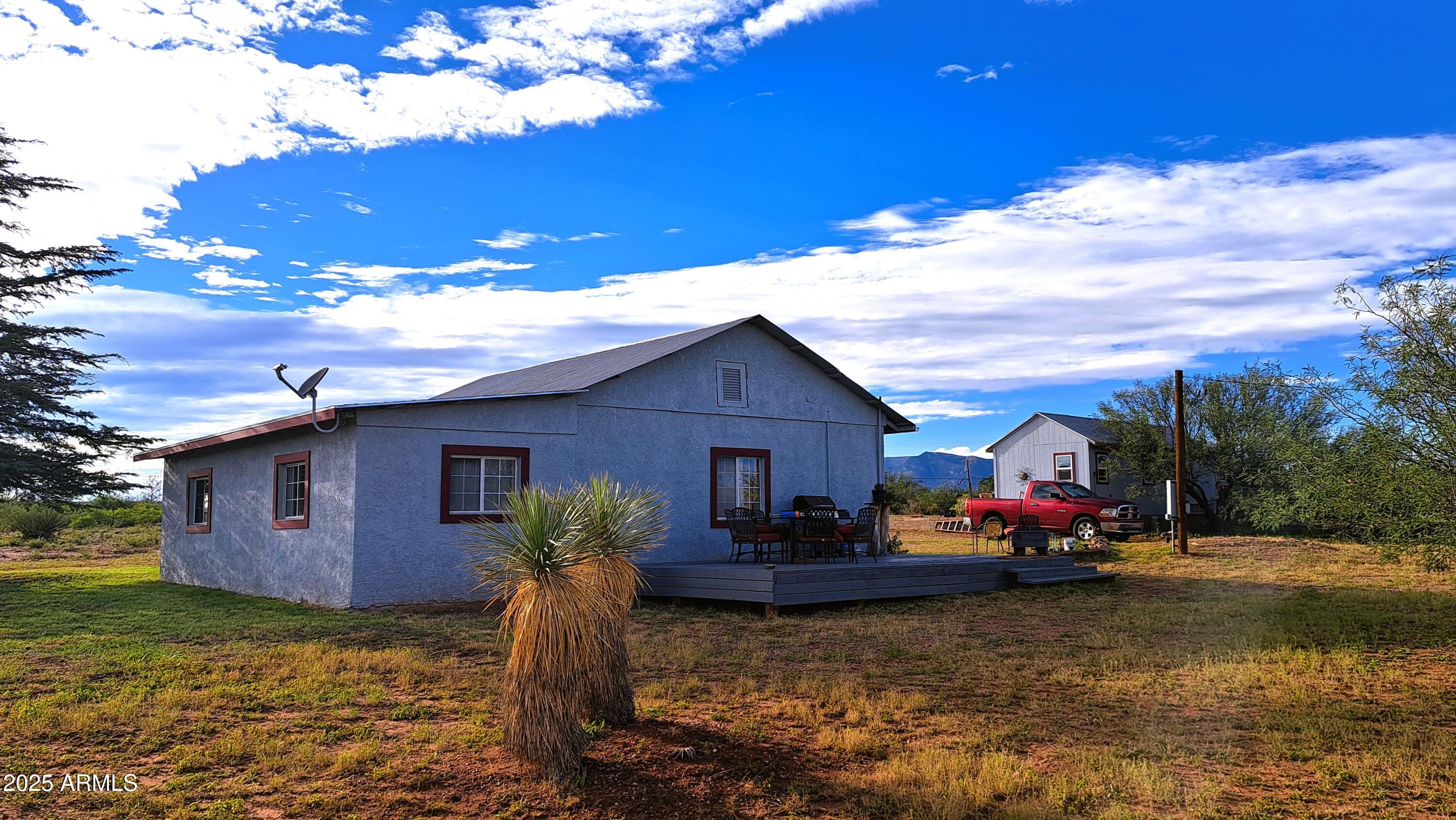 653 East Border Road Bisbee, AZ 85603 - Photo 2 of 29 a view of a house with backyard and sitting area