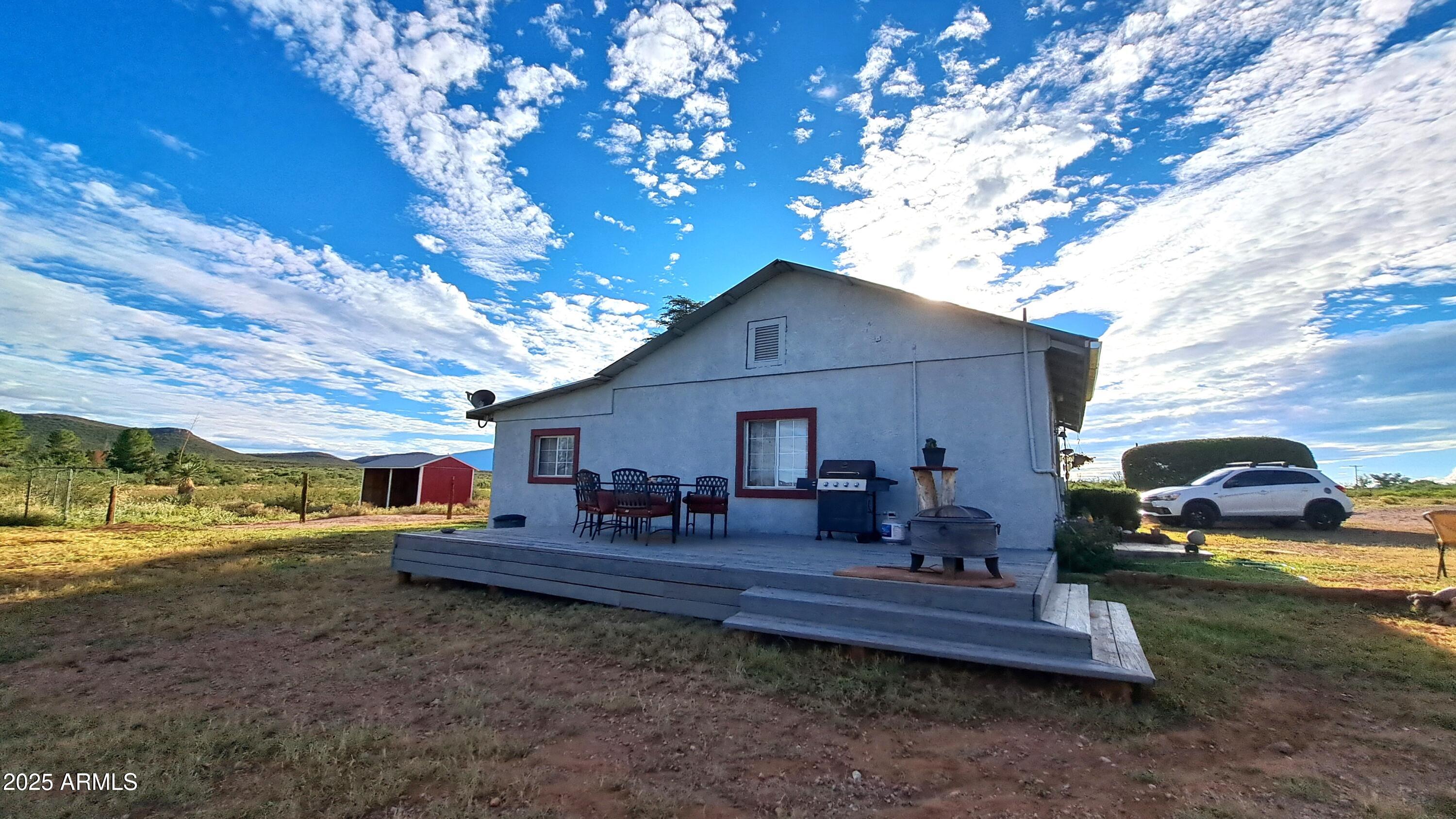 653 East Border Road Bisbee, AZ 85603 - Photo 23 of 29 a view of a house with backyard and sitting area