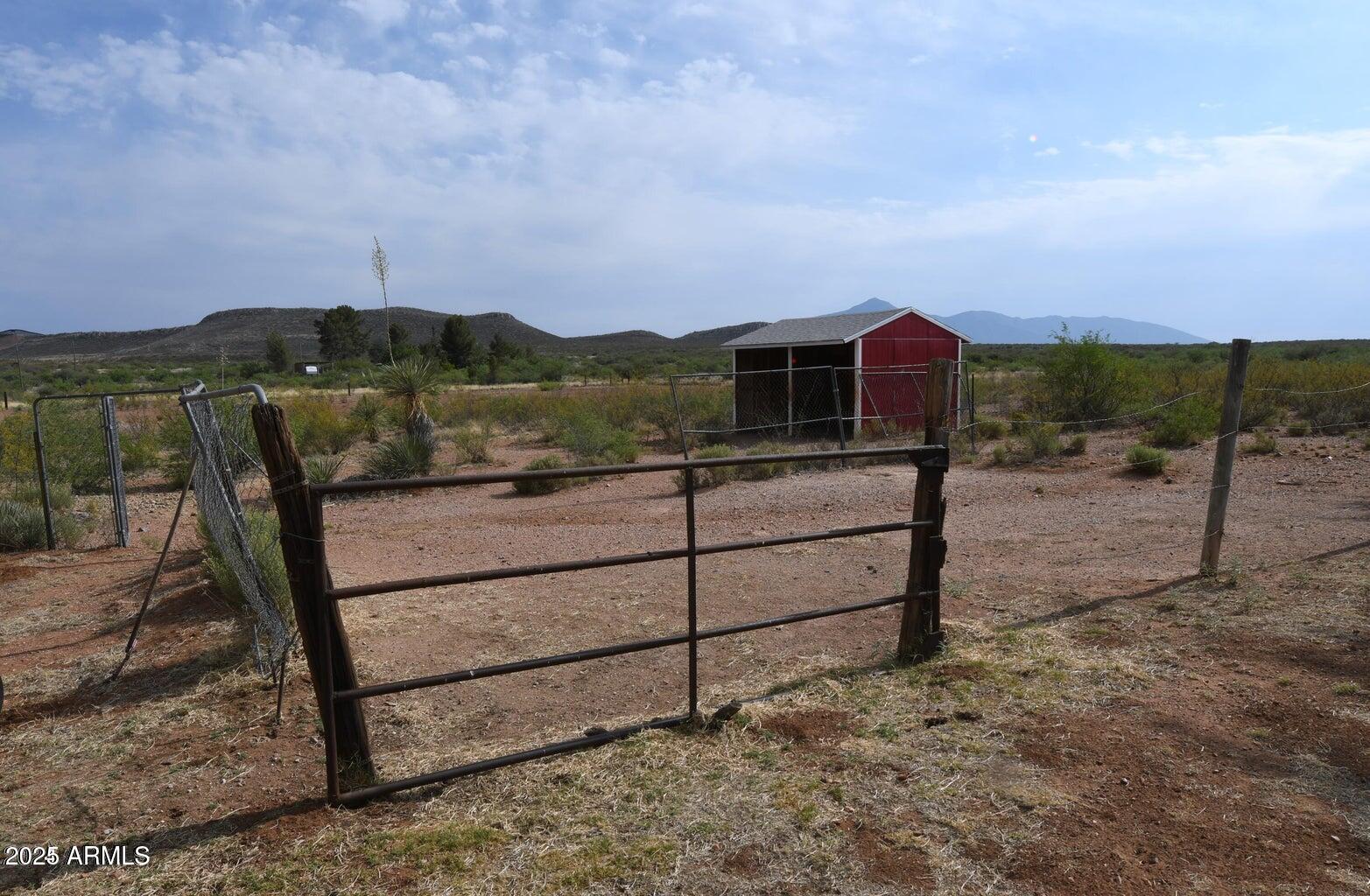 653 East Border Road Bisbee, AZ 85603 - Photo 26 of 29 a view of a yard with wooden fence