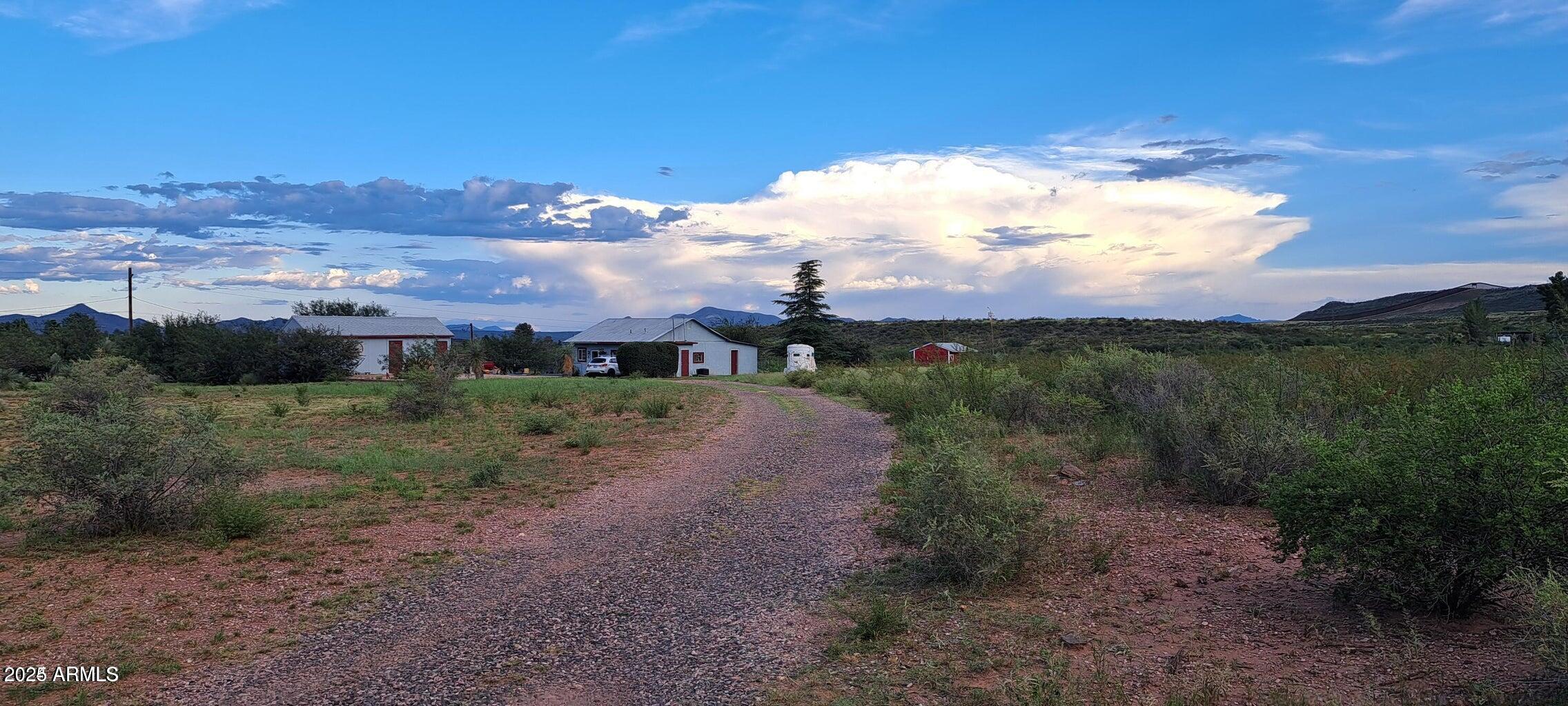 653 East Border Road Bisbee, AZ 85603 - Photo 3 of 29 a view of a big yard with mountain