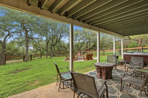 a view of a porch with furniture and yard