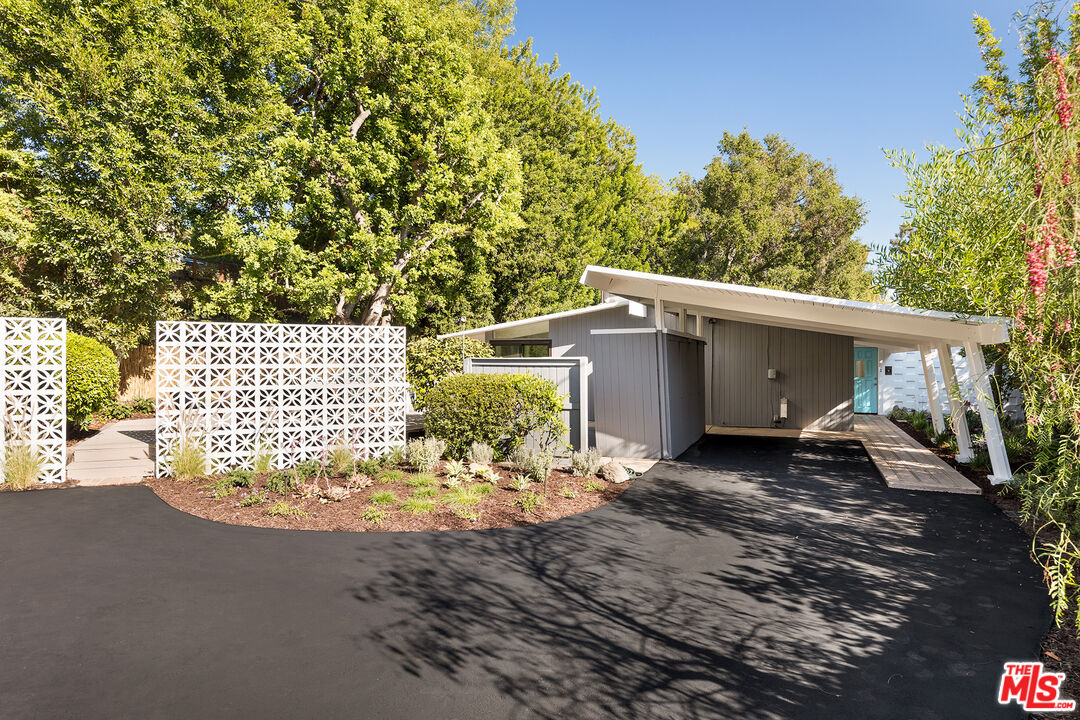 810 Bramble Way Los Angeles, CA 90049 - Photo 15 of 19 a view of a house with a yard