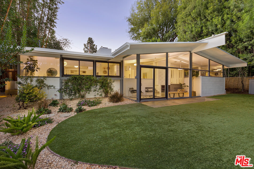810 Bramble Way Los Angeles, CA 90049 - Photo 19 of 19 a view of a house with a backyard