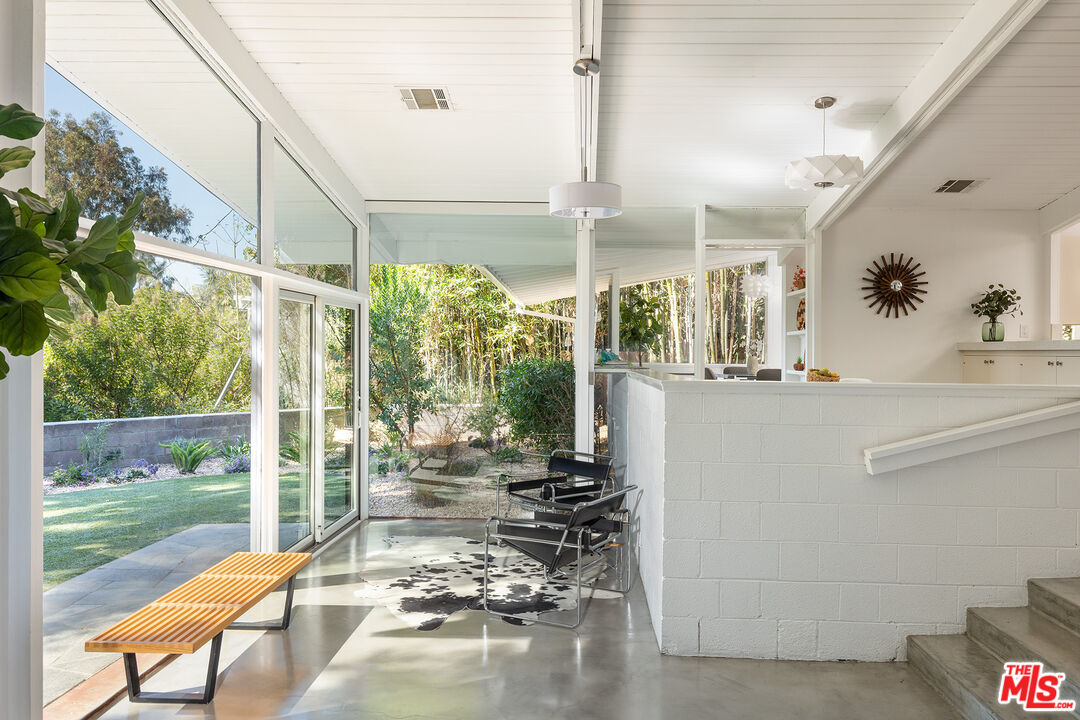 810 Bramble Way Los Angeles, CA 90049 - Photo 3 of 19 a view of a porch with chairs and backyard