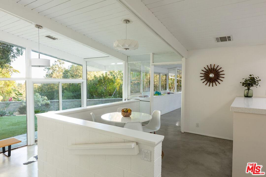810 Bramble Way Los Angeles, CA 90049 - Photo 4 of 19 a living room with furniture and a large window