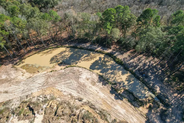 a view of swimming pool with a yard