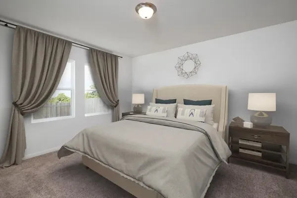 a bedroom with a bed and a couch
