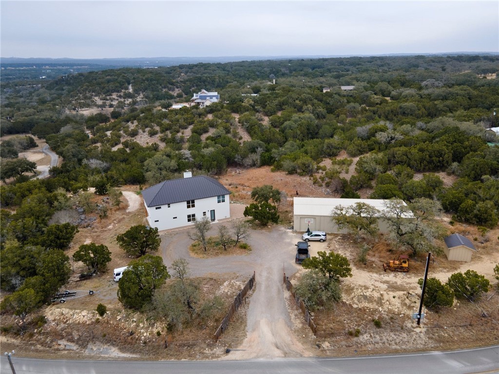 an aerial view of a house with a yard