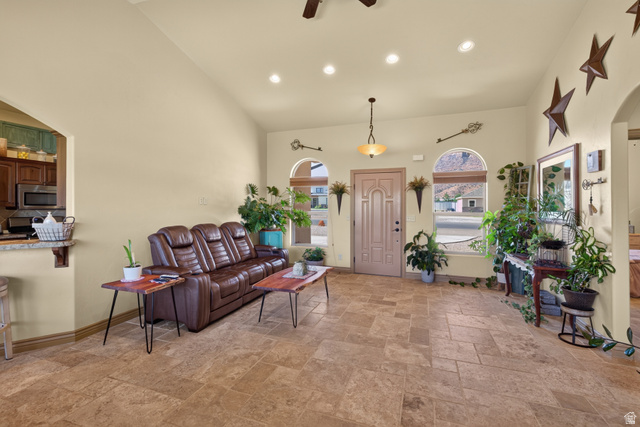 4635 East Sunny Acres Lane Moab, UT 84532 - Photo 42 of 56 Spacious living area featuring neutral-toned walls, tile flooring, and a vaulted ceiling