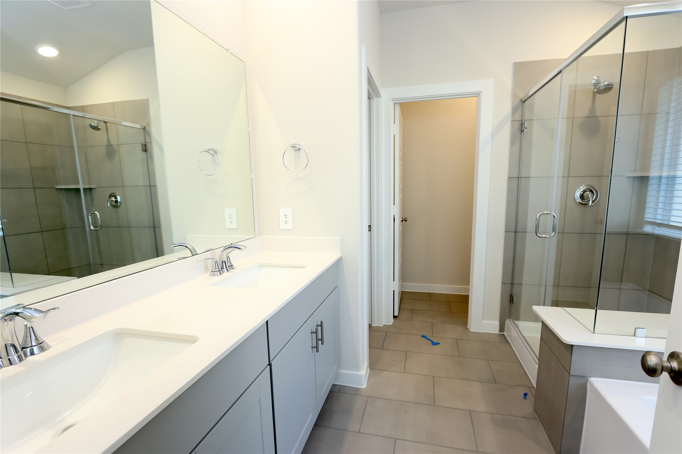 1435 Waggoner Rnch Trail Conroe, TX 77301 - Photo 13 of 17 a spacious bathroom with a shower sink and mirror