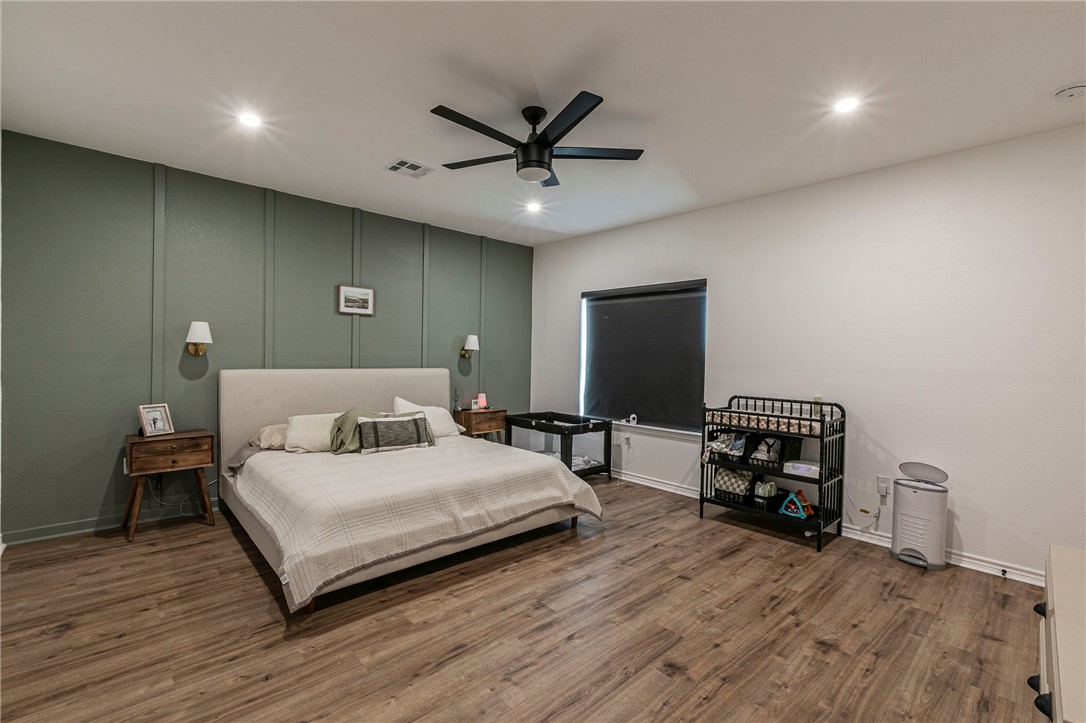 1973 Jackson Lane China Spring, TX 76633 - Photo 18 of 34 a bedroom with a bed and a flat screen tv