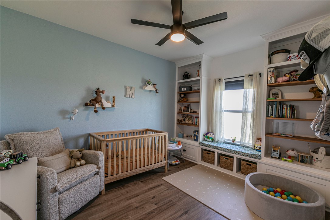 1973 Jackson Lane China Spring, TX 76633 - Photo 20 of 34 a bedroom with furniture and a book shelf