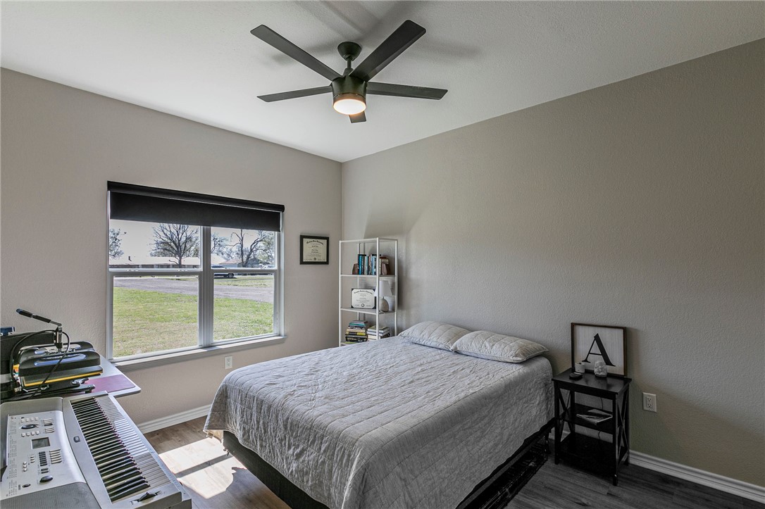 1973 Jackson Lane China Spring, TX 76633 - Photo 22 of 34 a bedroom with a large bed and a window