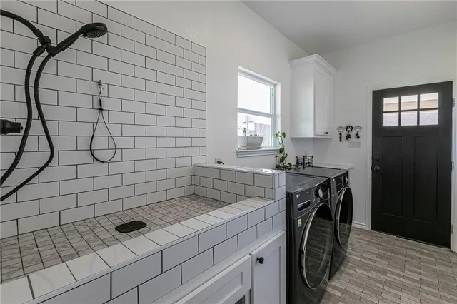 a work room with furniture and a flat screen tv