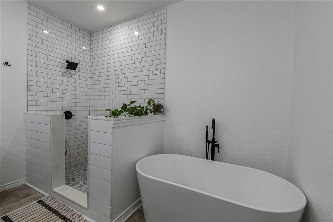 1973 Jackson Lane China Spring, TX 76633 - Photo 26 of 34 a white bath tub sitting next to a white sink