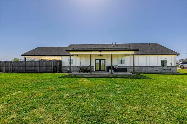 a view of yard with swimming pool and outdoor seating