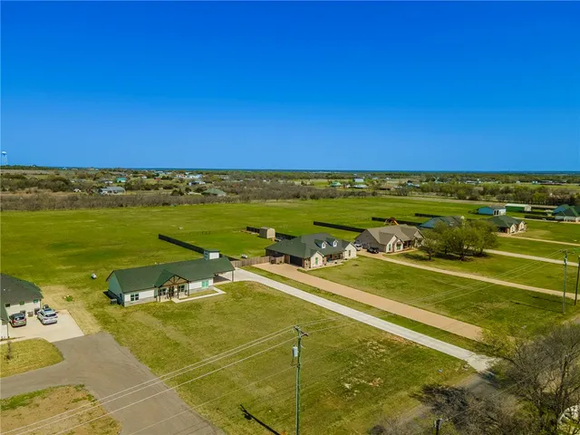 a view of an ocean and a houses
