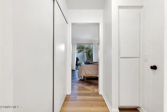 a view of a bedroom from a hallway