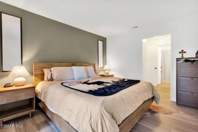 a bedroom with bed and a window