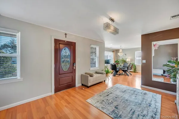 a bedroom with furniture and wooden floor