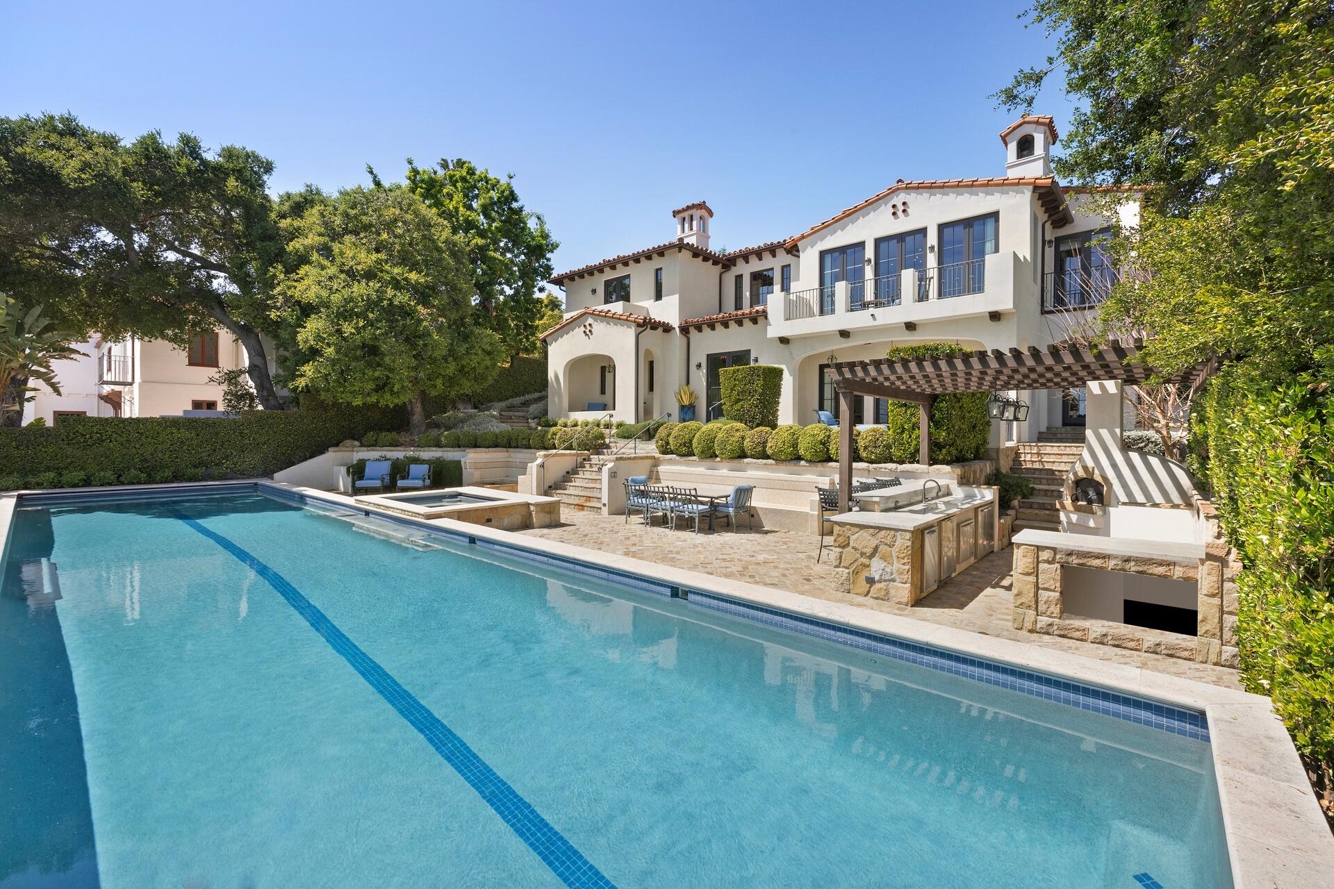 1117 Las Alturas Road Santa Barbara, CA 93103 - Photo 25 of 28 a front view of a house with garden and trees