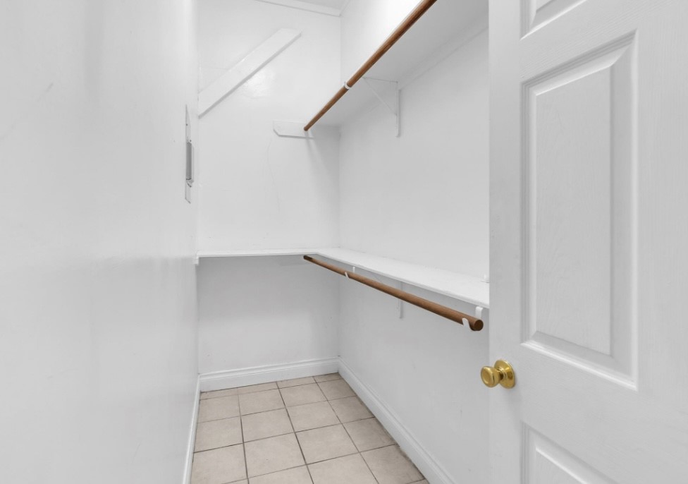 9678 Interstate 10 Frontage Road, Unit 1 Sealy, TX 77474 - Photo 17 of 19 a view of walk in closet with empty racks