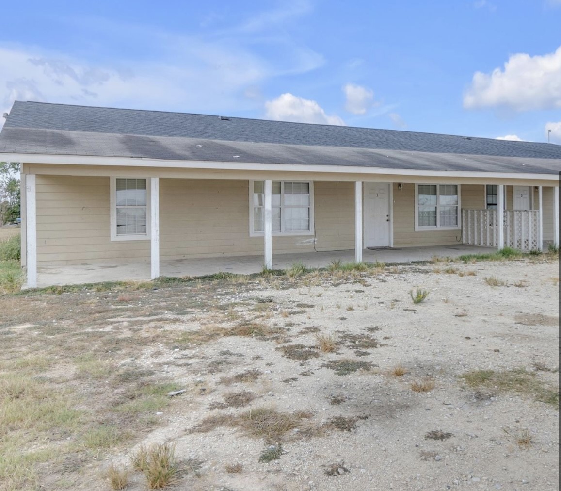 9678 Interstate 10 Frontage Road, Unit 1 Sealy, TX 77474 - Photo 2 of 19 front view of a house
