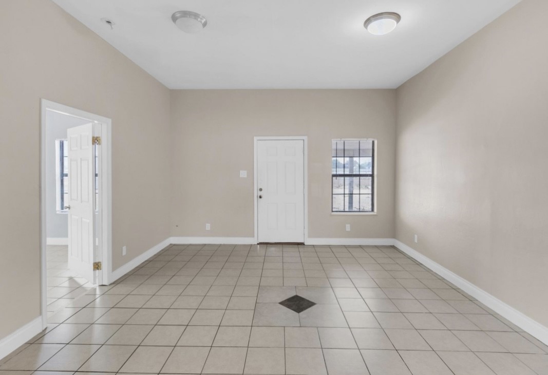 9678 Interstate 10 Frontage Road, Unit 1 Sealy, TX 77474 - Photo 5 of 19 an empty room with windows