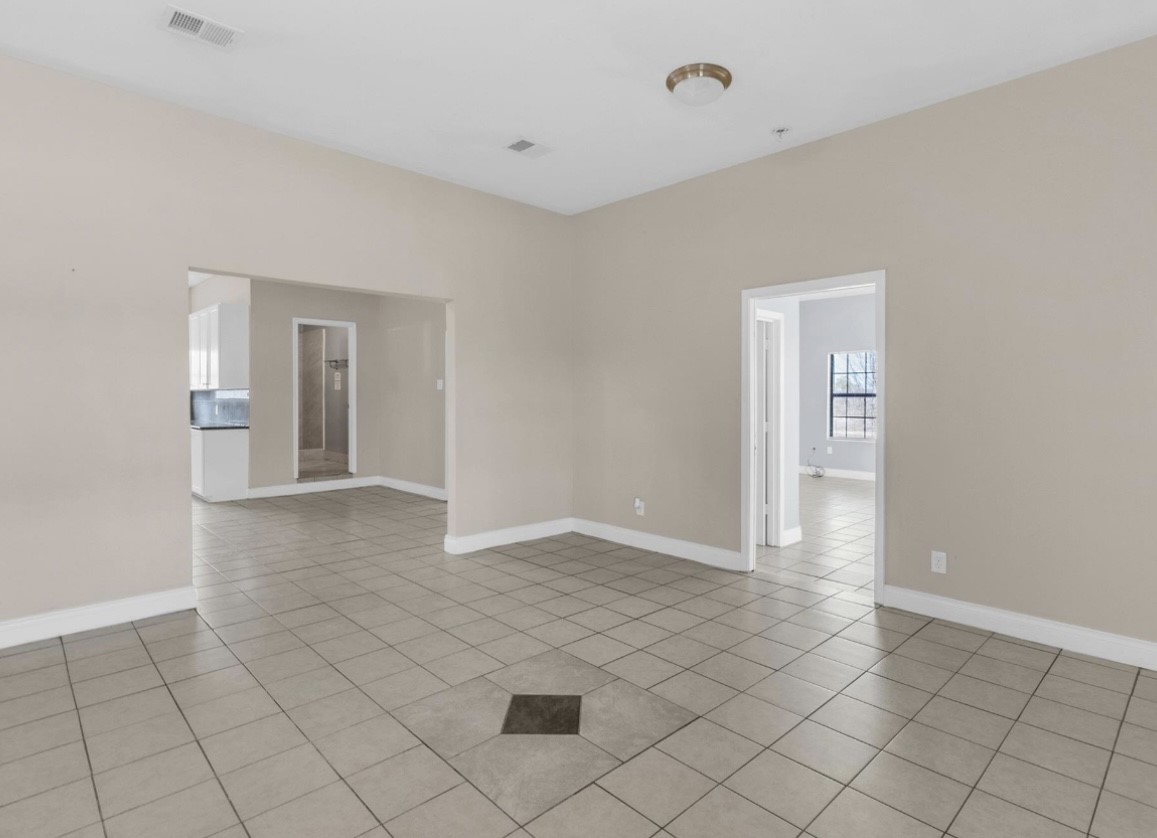9678 Interstate 10 Frontage Road, Unit 1 Sealy, TX 77474 - Photo 6 of 19 a view of an empty room and window
