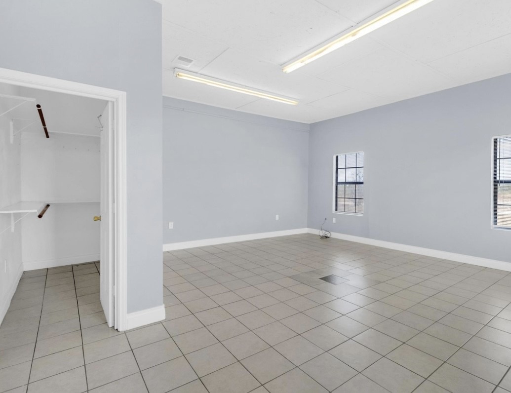 9678 Interstate 10 Frontage Road, Unit 1 Sealy, TX 77474 - Photo 7 of 19 a view of an empty room and window