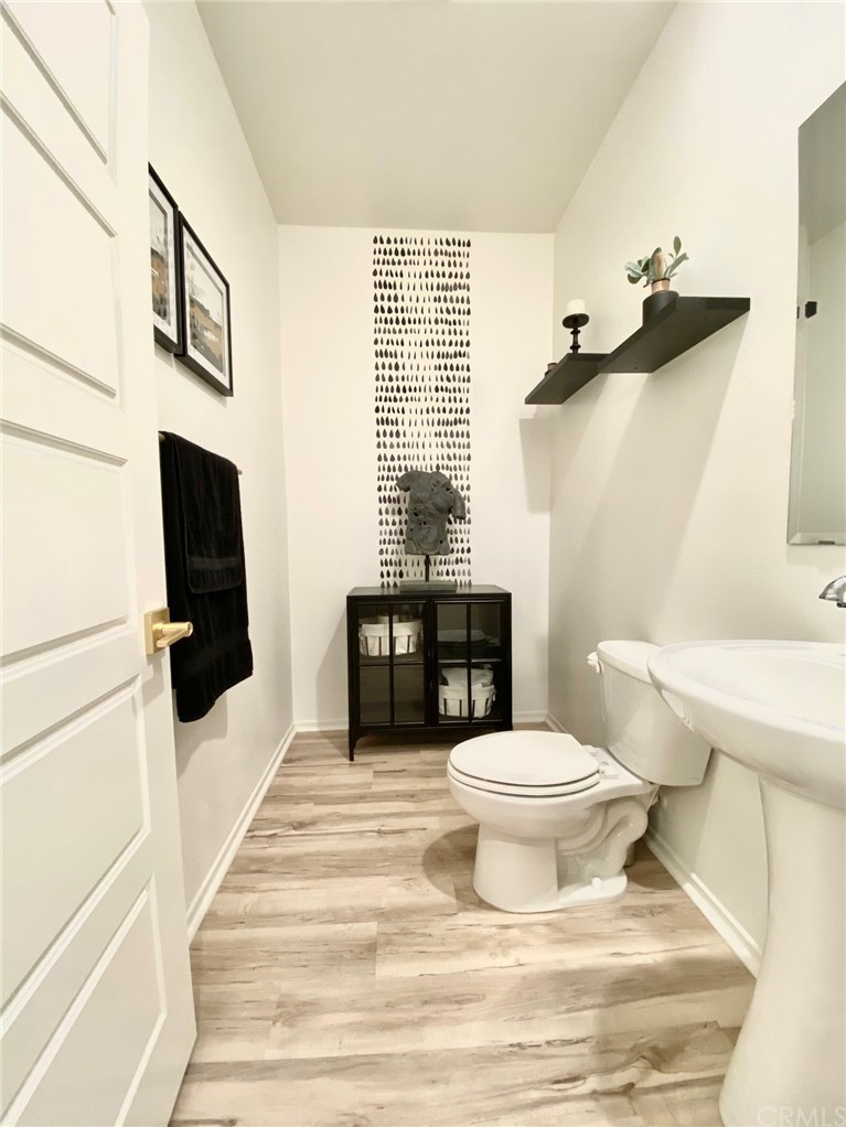 858 Blue Orchid Beaumont, CA 92223 - Photo 11 of 33 a bathroom with a sink toilet and shower