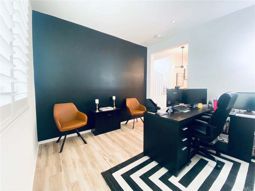 858 Blue Orchid Beaumont, CA 92223 - Photo 13 of 33 a workspace with furniture and lamp