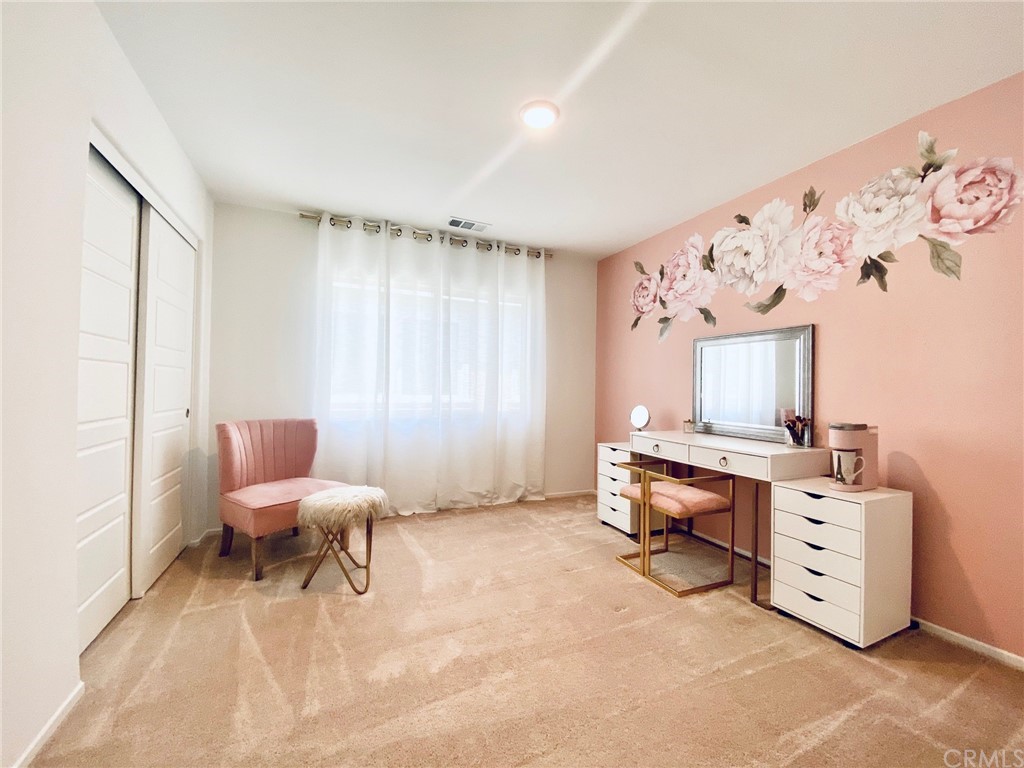 858 Blue Orchid Beaumont, CA 92223 - Photo 19 of 33 a room with furniture and a window