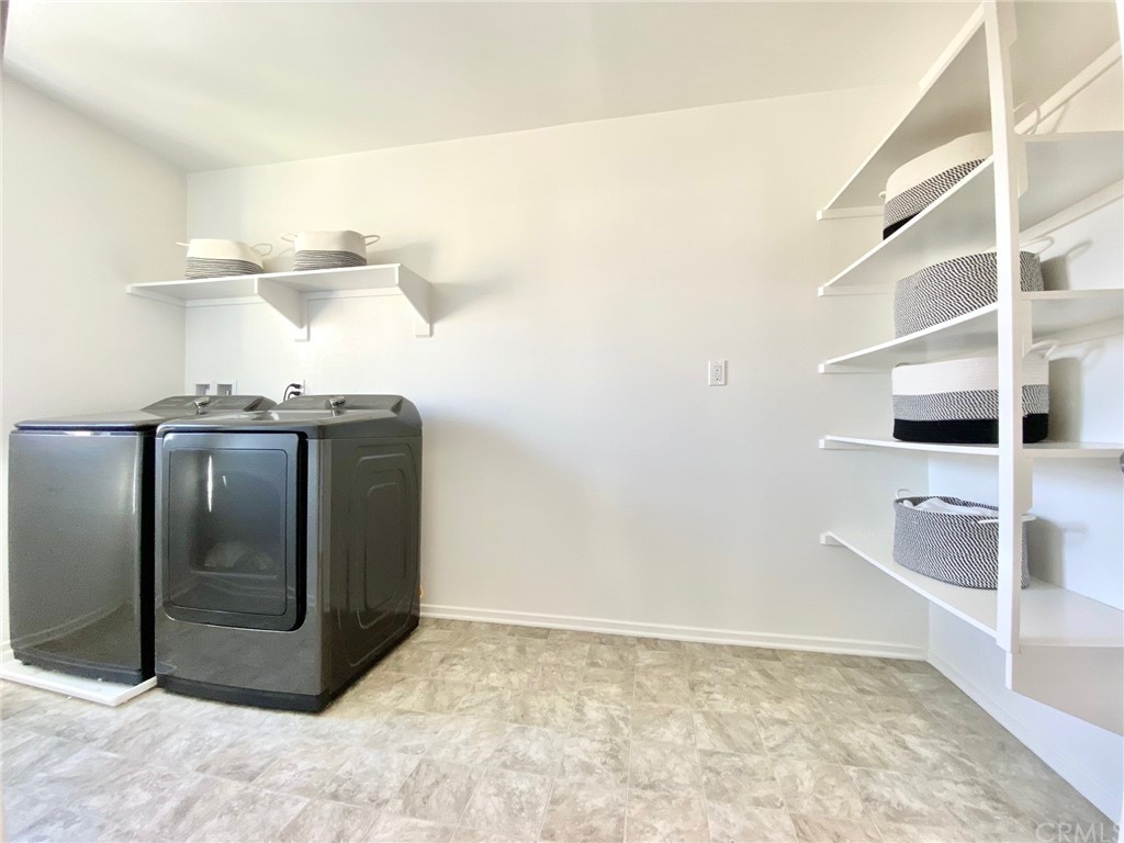 858 Blue Orchid Beaumont, CA 92223 - Photo 28 of 33 a view of a refrigerator in kitchen and a sink