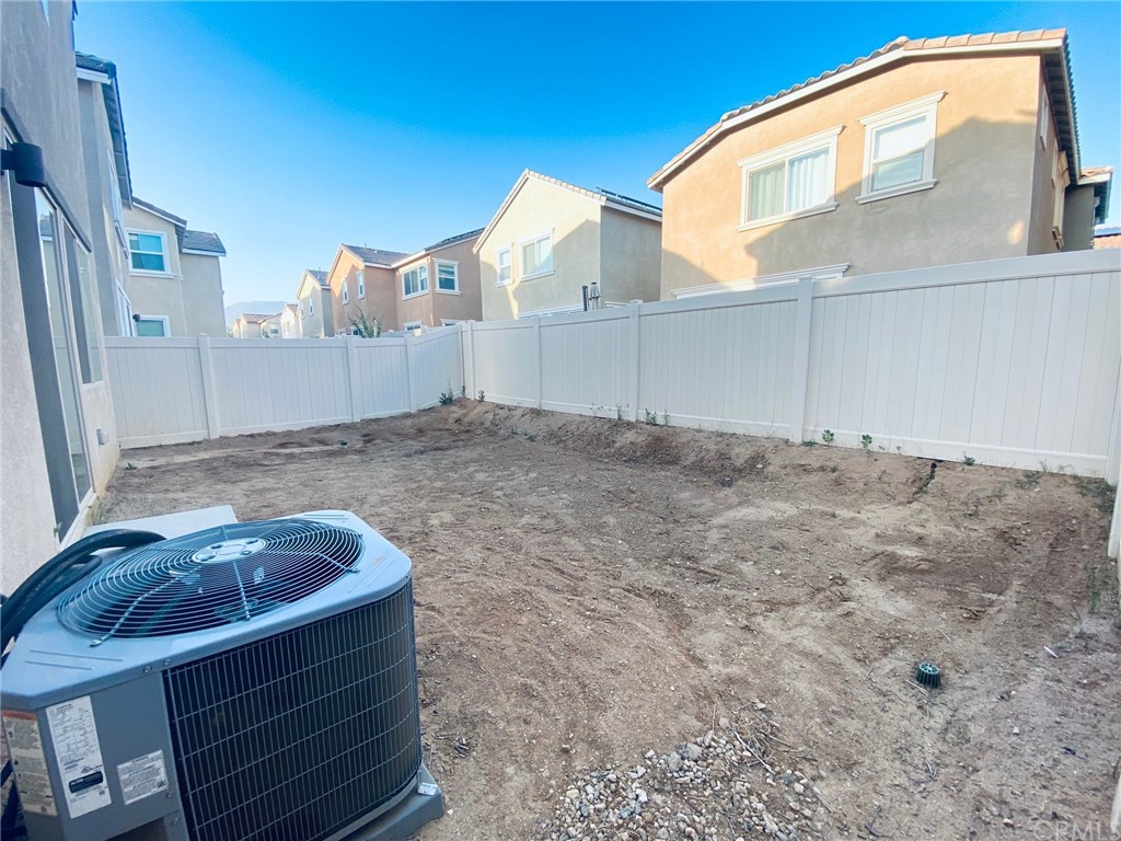 858 Blue Orchid Beaumont, CA 92223 - Photo 30 of 33 a view of a house with backyard and shower