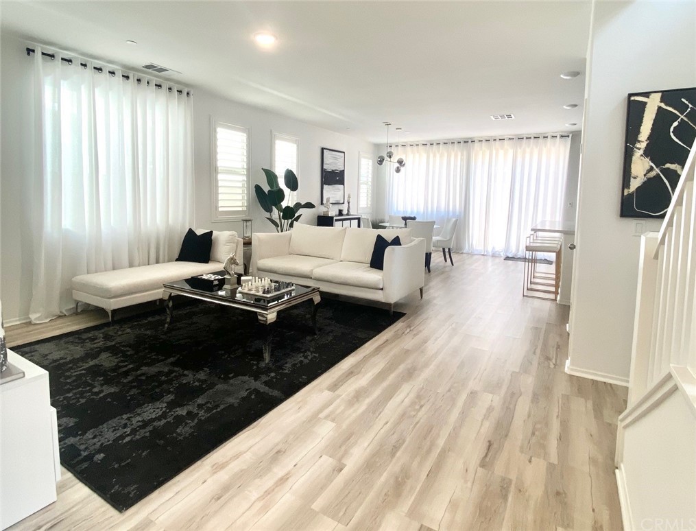 858 Blue Orchid Beaumont, CA 92223 - Photo 3 of 33 a living room with furniture windows and a wooden floor