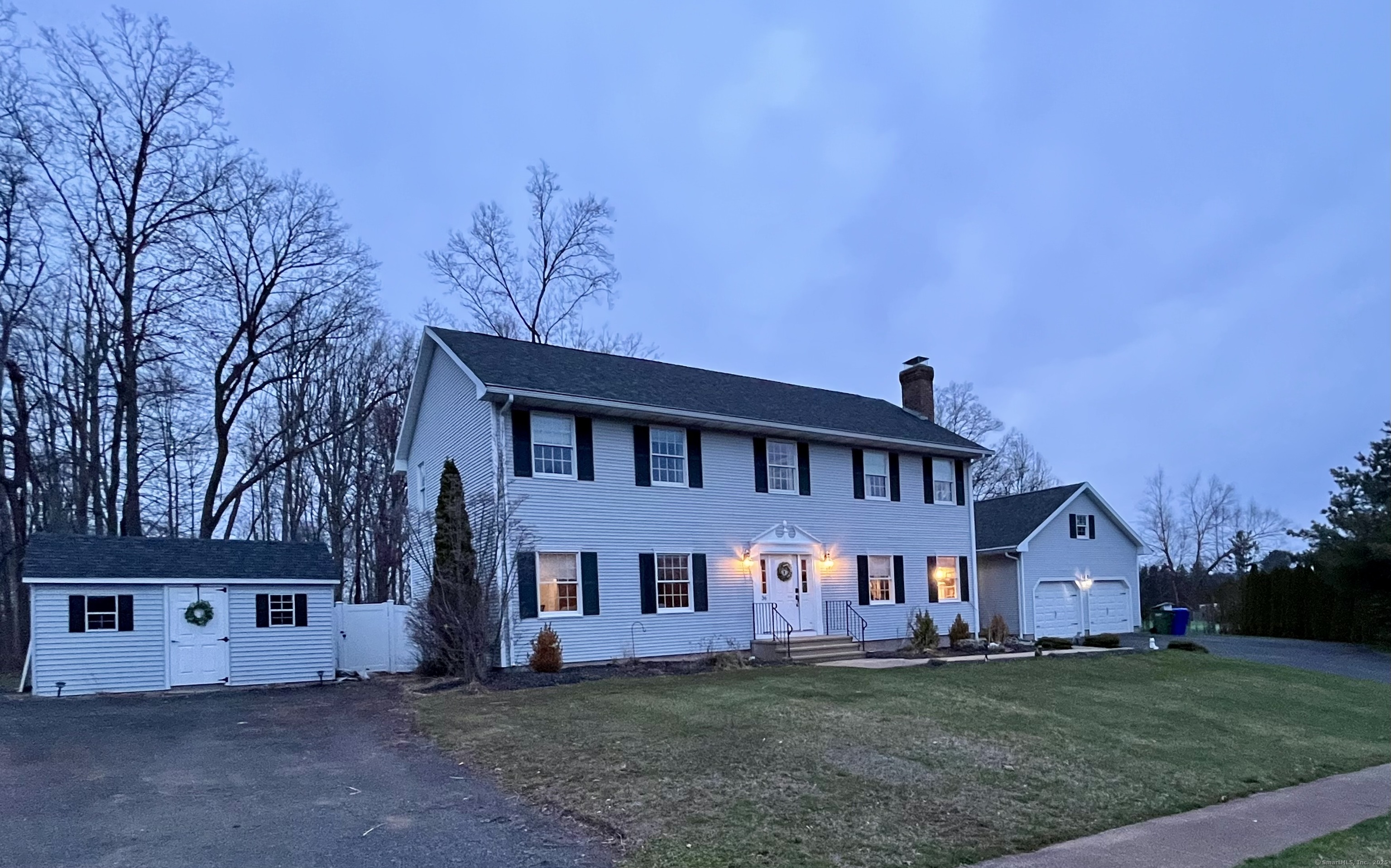 a view of house with a big yard