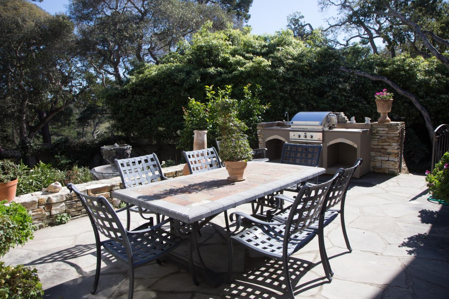 25951 Ridgewood Road Carmel, CA 93923 - Photo 13 of 23 a view of a dinning table and chairs on the deck
