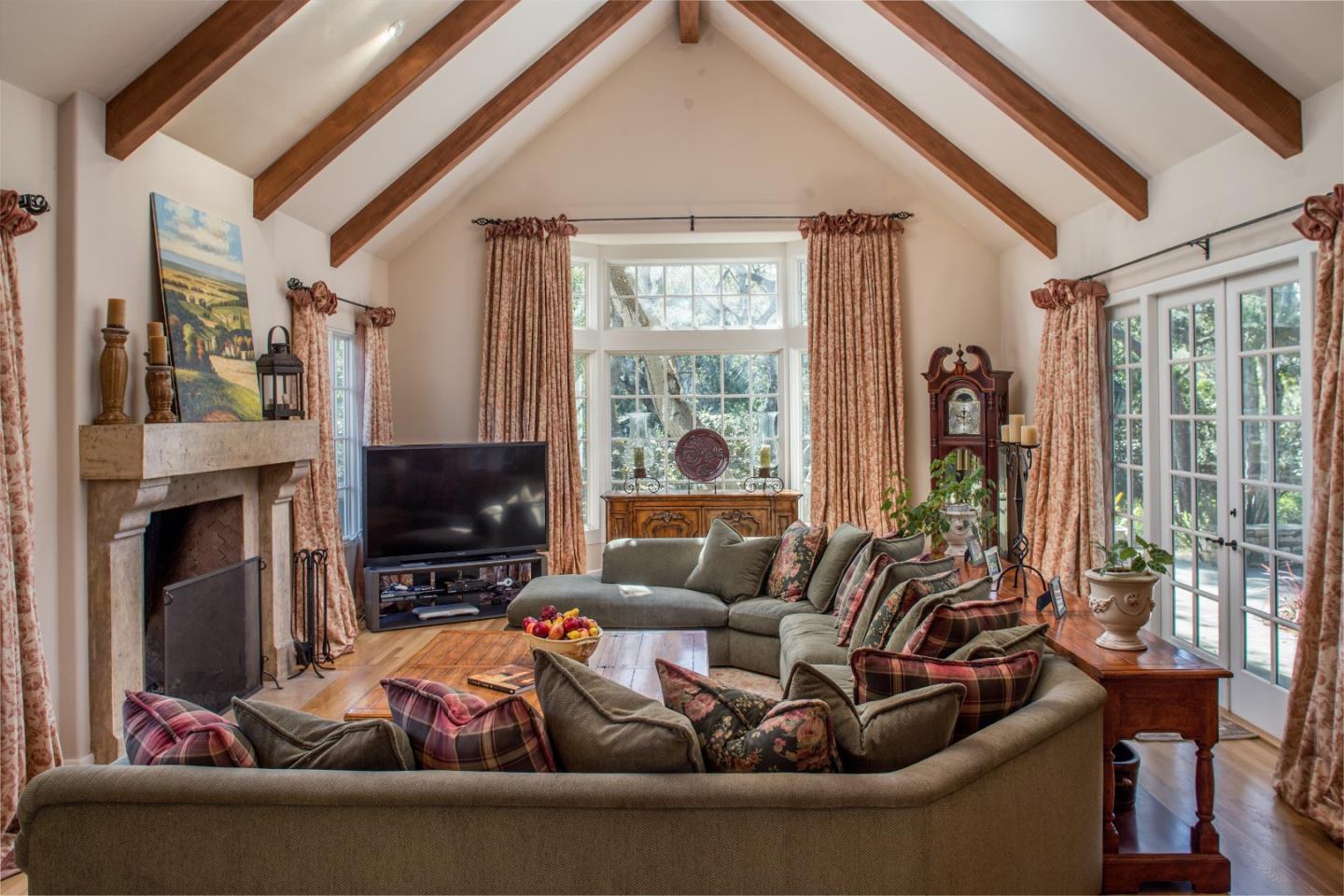 25951 Ridgewood Road Carmel, CA 93923 - Photo 6 of 23 a living room with furniture a fireplace and a flat screen tv