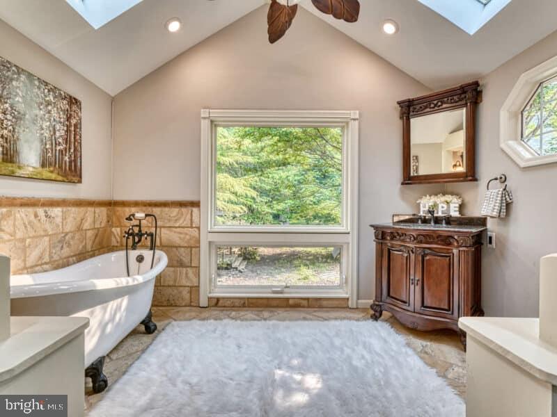 19701 Old York Road White Hall, MD 21161 - Photo 16 of 17 a spacious bathroom with a tub sink and mirror