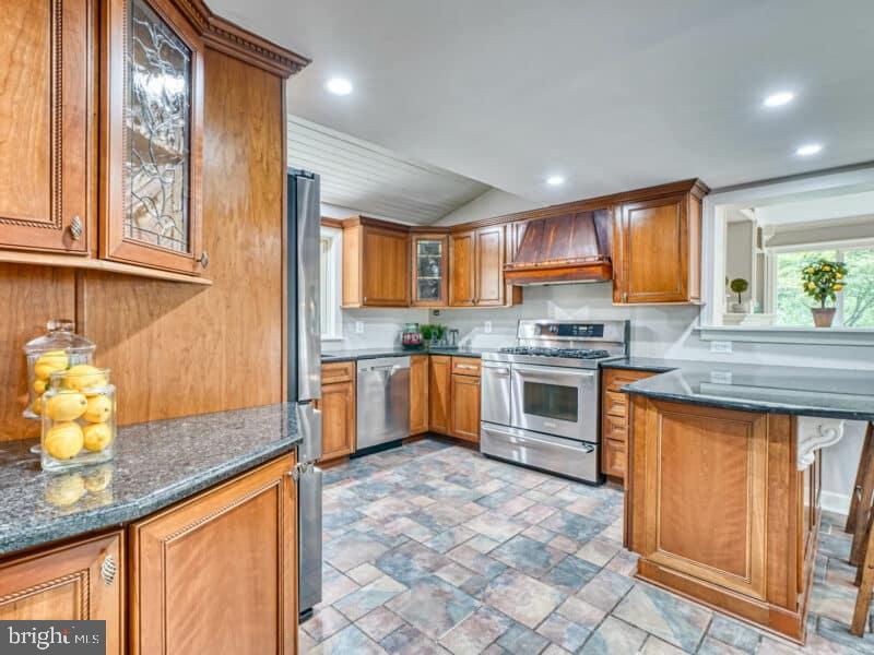 19701 Old York Road White Hall, MD 21161 - Photo 7 of 17 a kitchen with stainless steel appliances granite countertop a stove a sink and a microwave